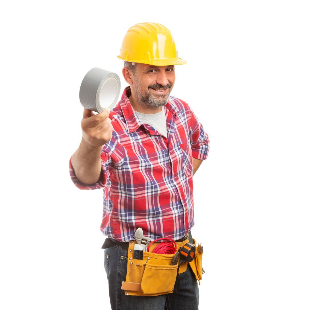 Man in yellow hard hat holding a roll of duct tape toward the camera, wearing a red plaid shirt and tool belt on a white background