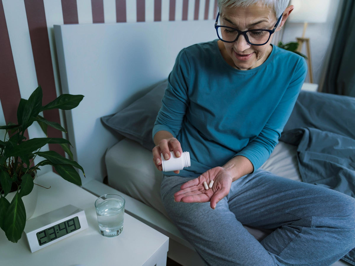 Woman taking melatonin 
