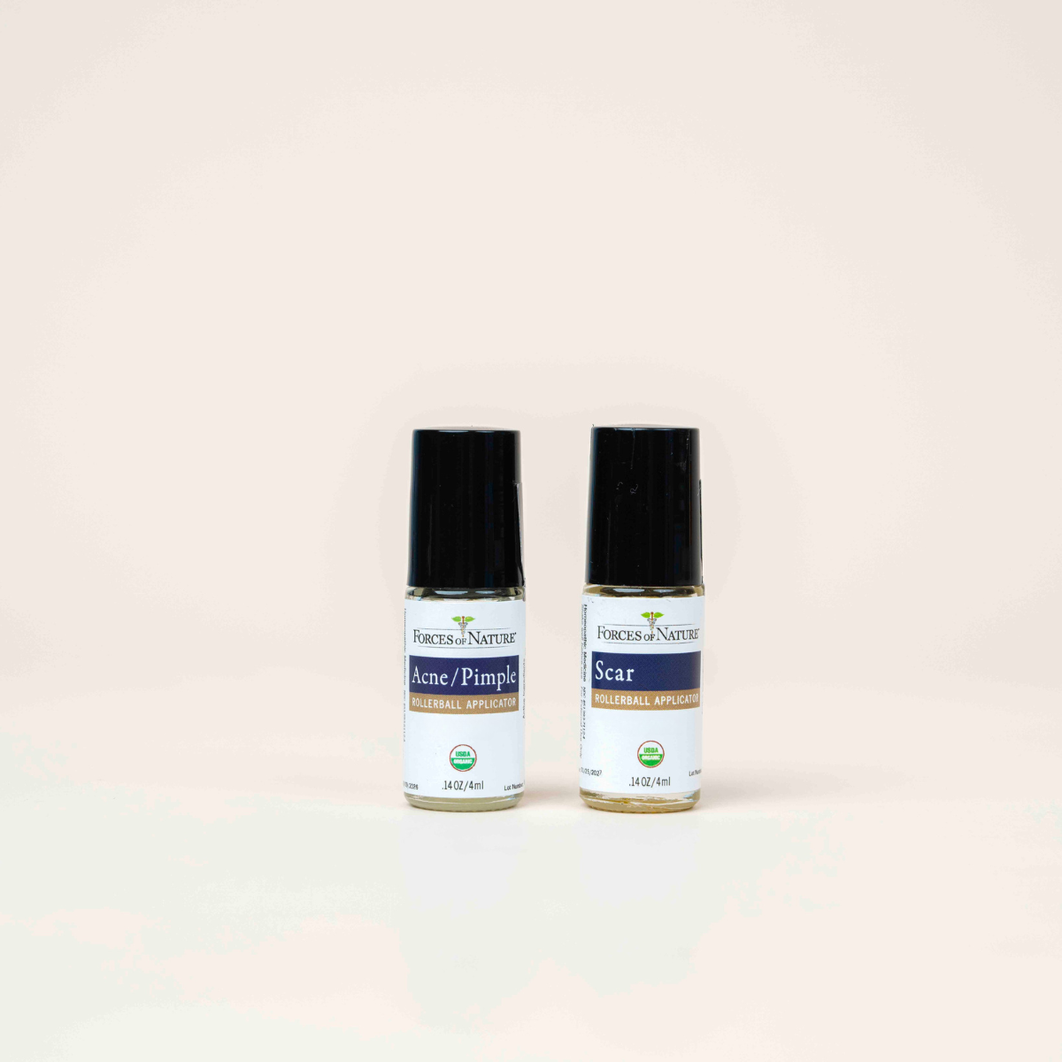 Forces of Nature Acne Pimple and Scar Rollerball Applicators side by side.
