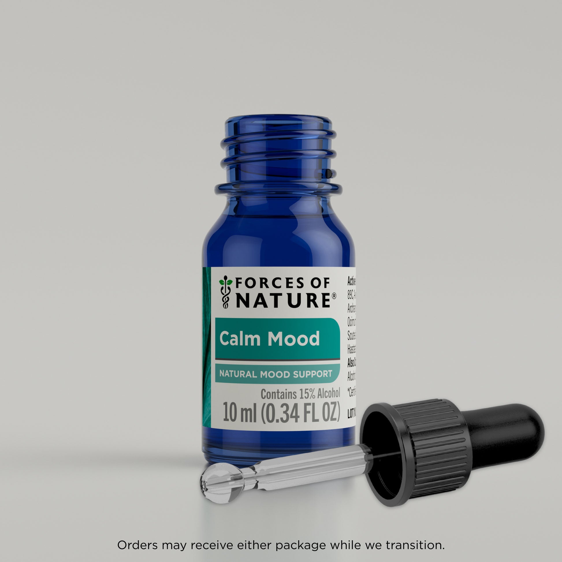 Blue bottle labeled 'Forces of Nature Calm Mood' with dropper on a gray background